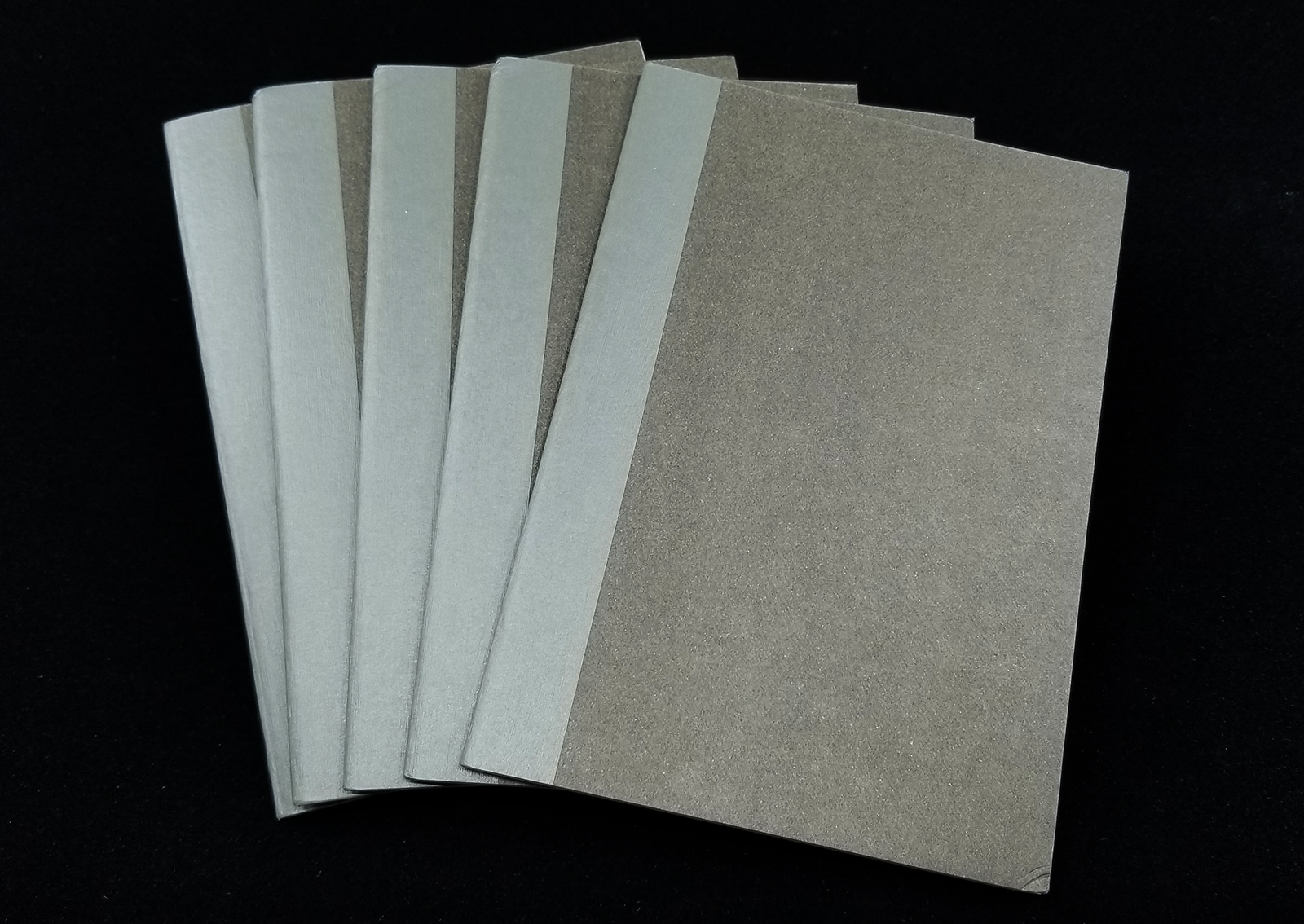 five muji a6 grid notebooks