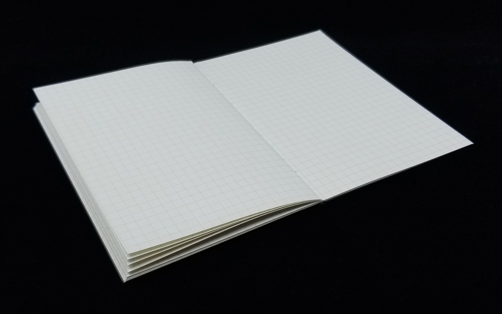 muji a6 grid notebook laying flat