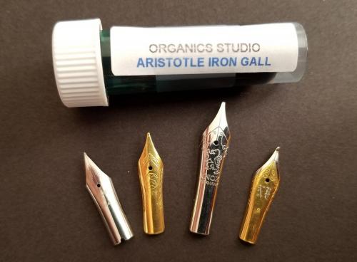 The four nibs (Pilot, Bock, Knox, and Jowo) positioned with the sample of Organics Studio Aristotle Iron Gall ink.