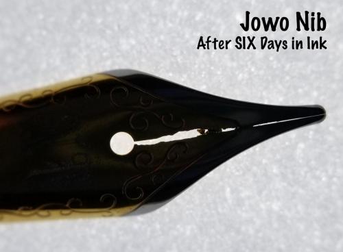Top view of the Jowo nib after six days in the Aristotle Iron Gall ink. This backlit view very nicely shows the damage to the steel around the nib's slit.