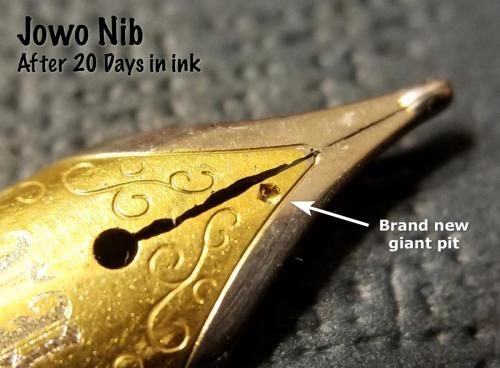 Top view of the Jowo nib after 20 days in the Aristotle Iron Gall ink. This view shows the corrosion around the slit and and one giant new pit on the face of the nib.